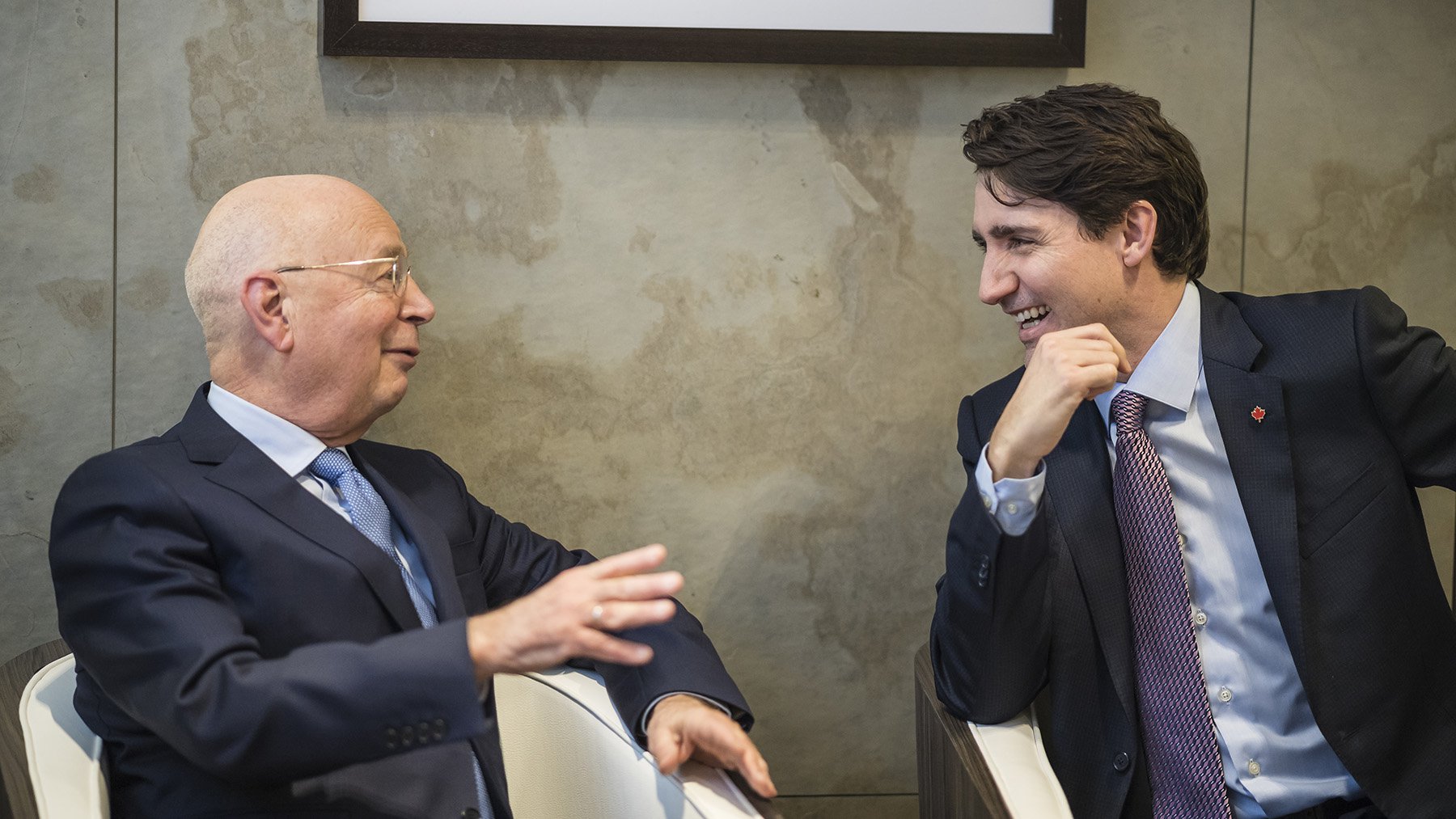 Klaus Schwab speaking to Justin Trudeau