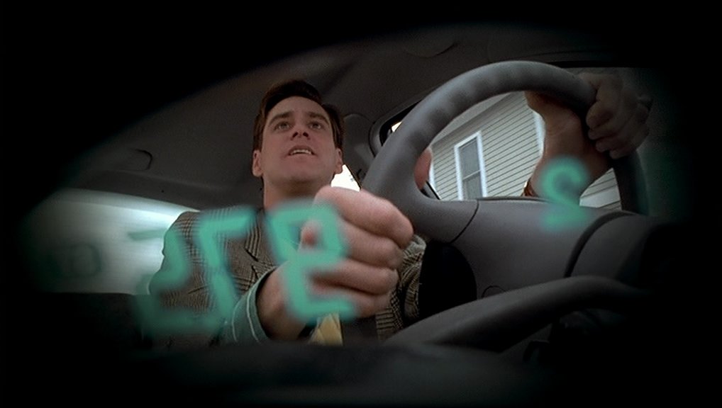 Truman behind the wheel of his car - The Truman Show (1998)