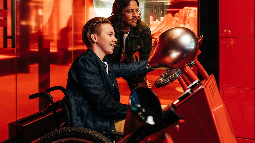 A wheelchair user interacts with the Foley Room at ACMI - Adam Gibson