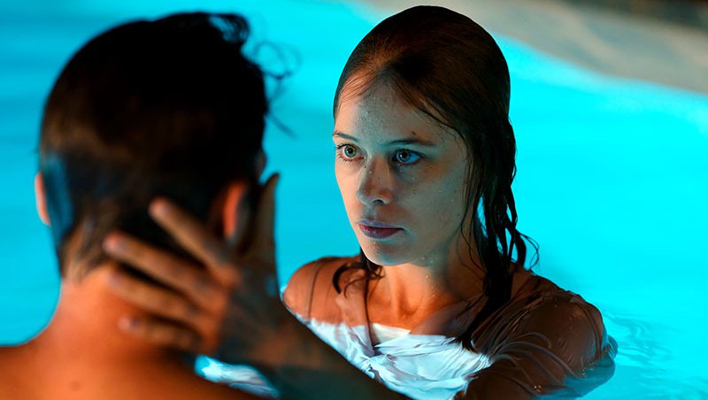 Paula Beer and Franz Rogowski in a pool, in a still from 'Undine' (2020) photo by Christian Schulz