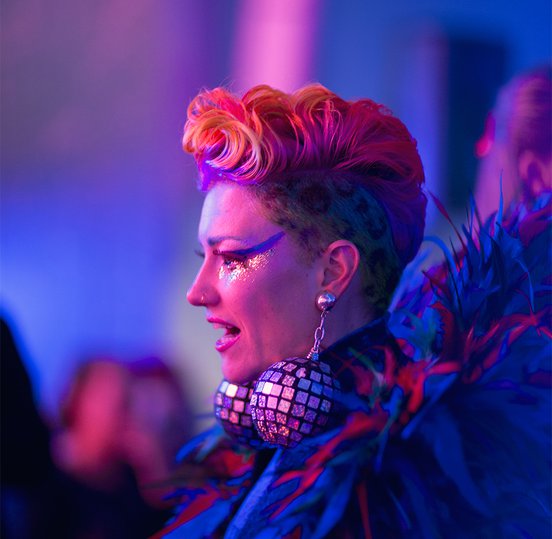 Woman with disco ball earrings at Wonderland Late Nights- photo by Field Carr.jpg