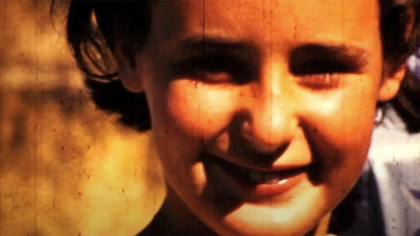 cropped - Still from Fond_Inland_Born - girl smiling - Ross Gibson - head_phone_film_poems.png