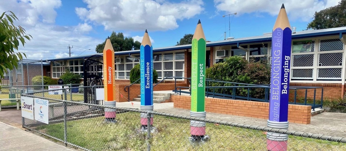 Large pencil sculptures are placed at the entrance of St Albans Heights Primary School. They portray the school values of: honesty, excellence, respect and belonging.