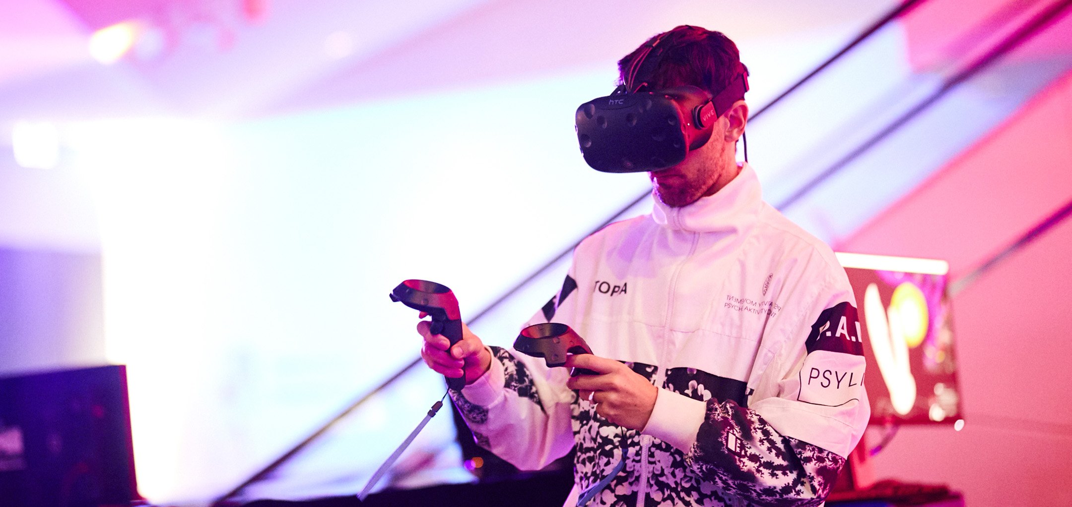 A man wearing a VR headset at ACMI