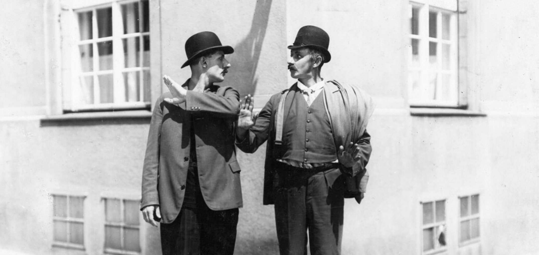 Two men in bowler hats in An Old Gangster's Molls (1927)